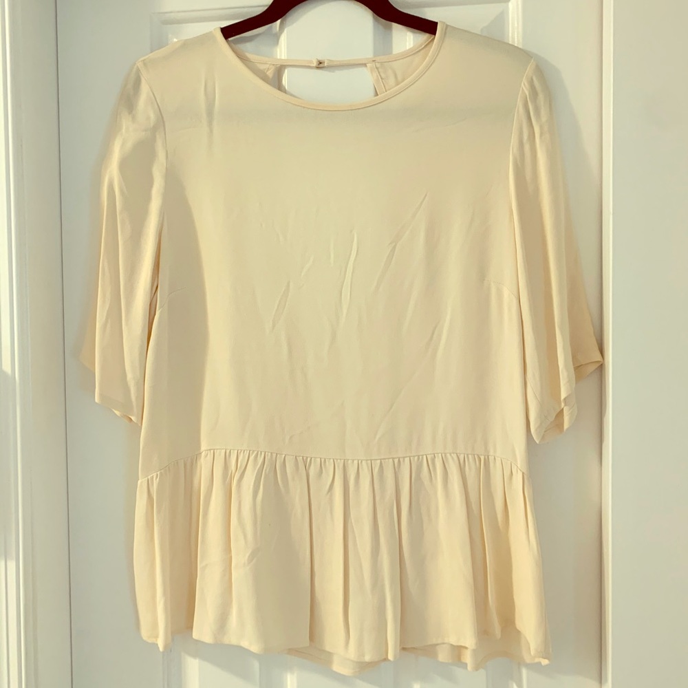 Ecru peplum top with low open back